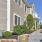 a few steps lead up to sidewalk and parking lot at Hastings Village